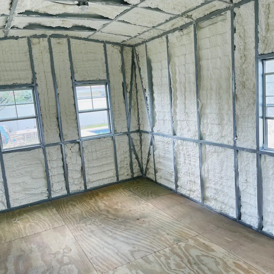 Closed-cell spray foam insulation applied to wall cavities in a residential project in Munster